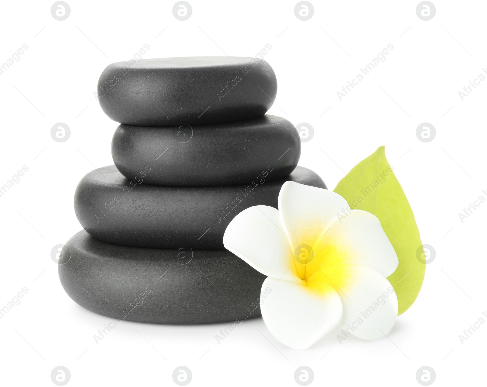 Photo of Spa stones with flower and leaf isolated on white