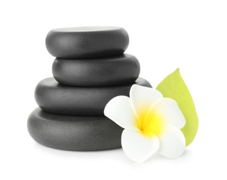 Photo of Spa stones with flower and leaf isolated on white