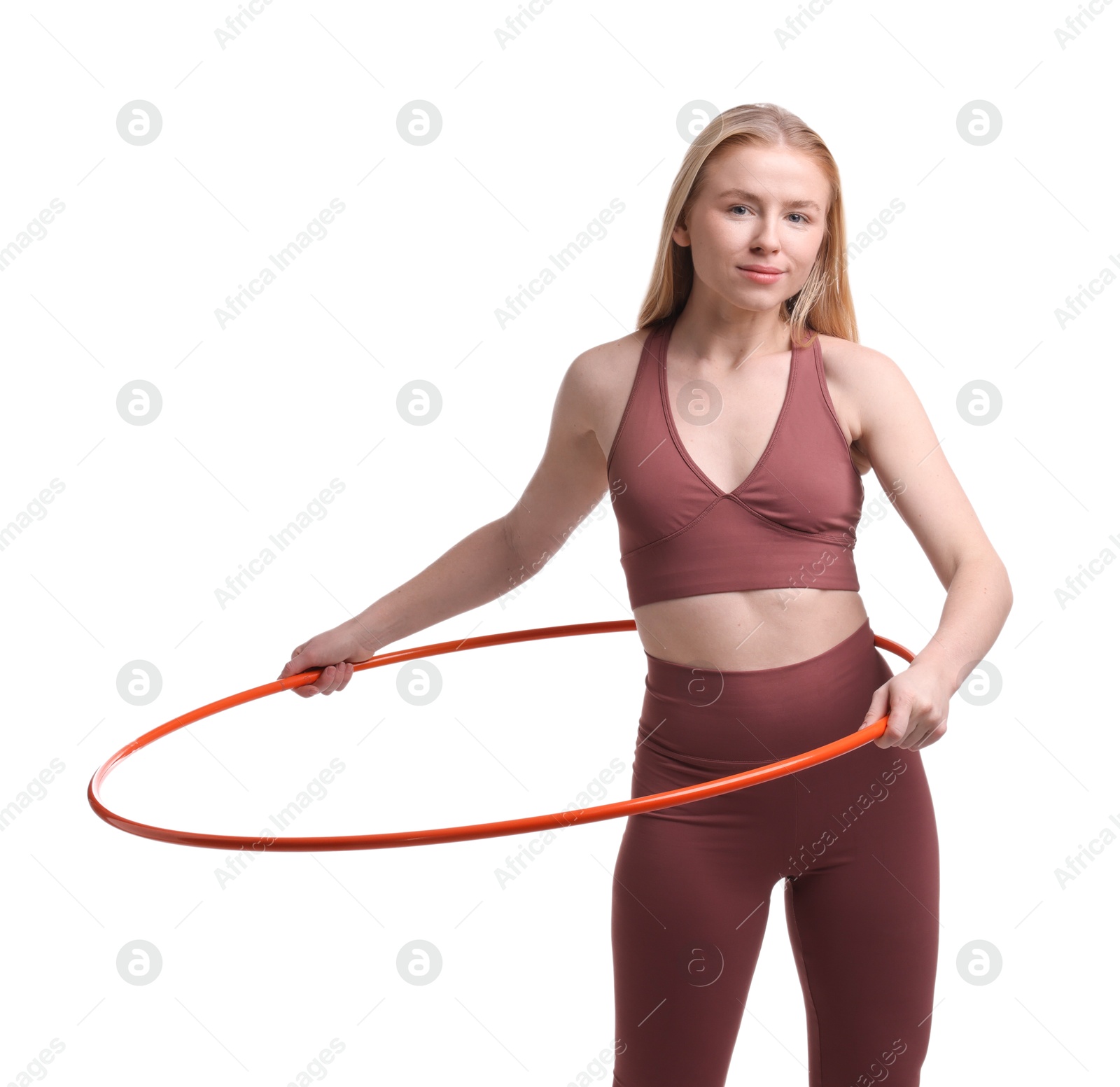 Photo of Beautiful young woman exercising with hula hoop on white background