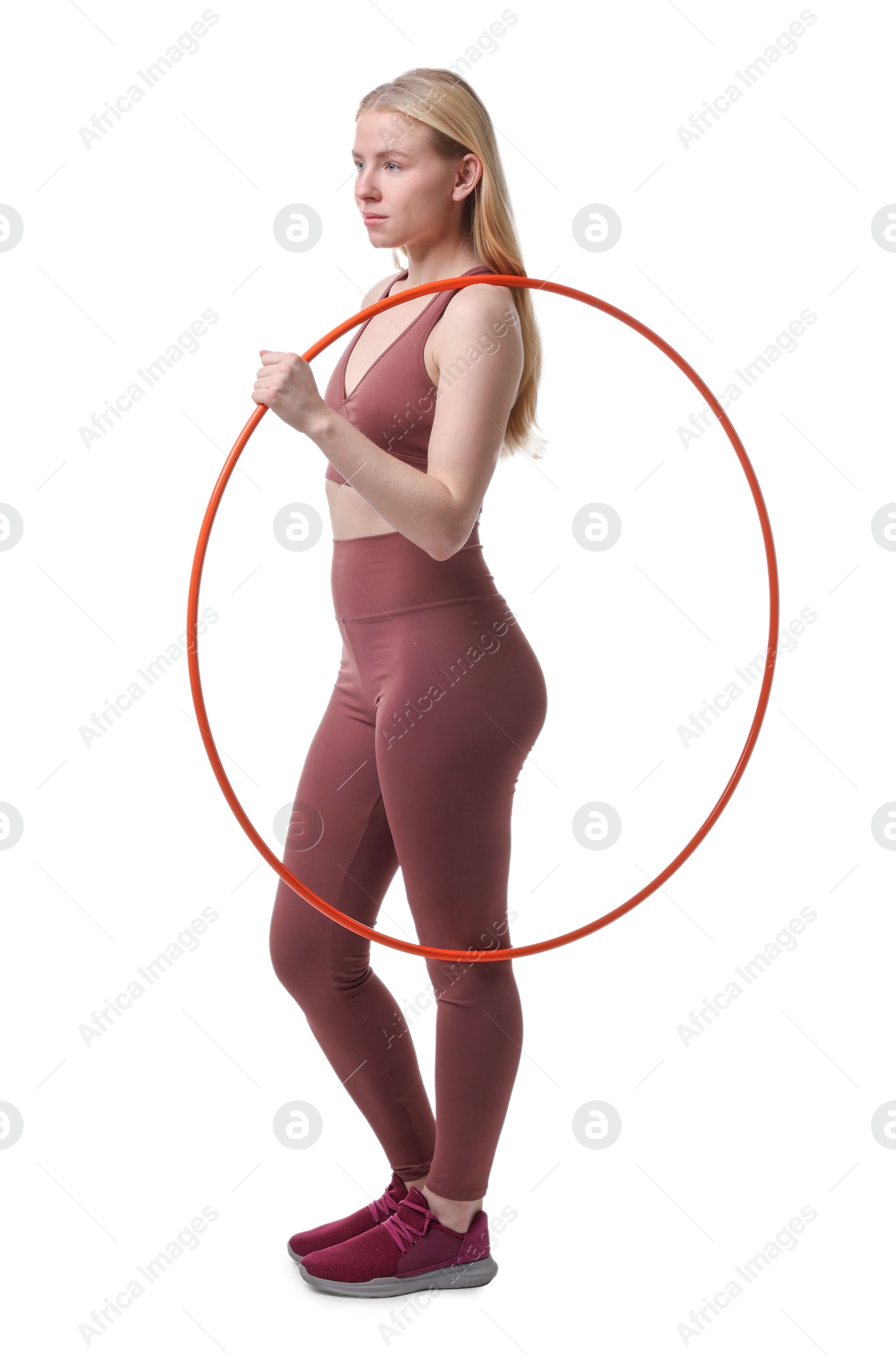 Photo of Beautiful young woman with hula hoop isolated on white