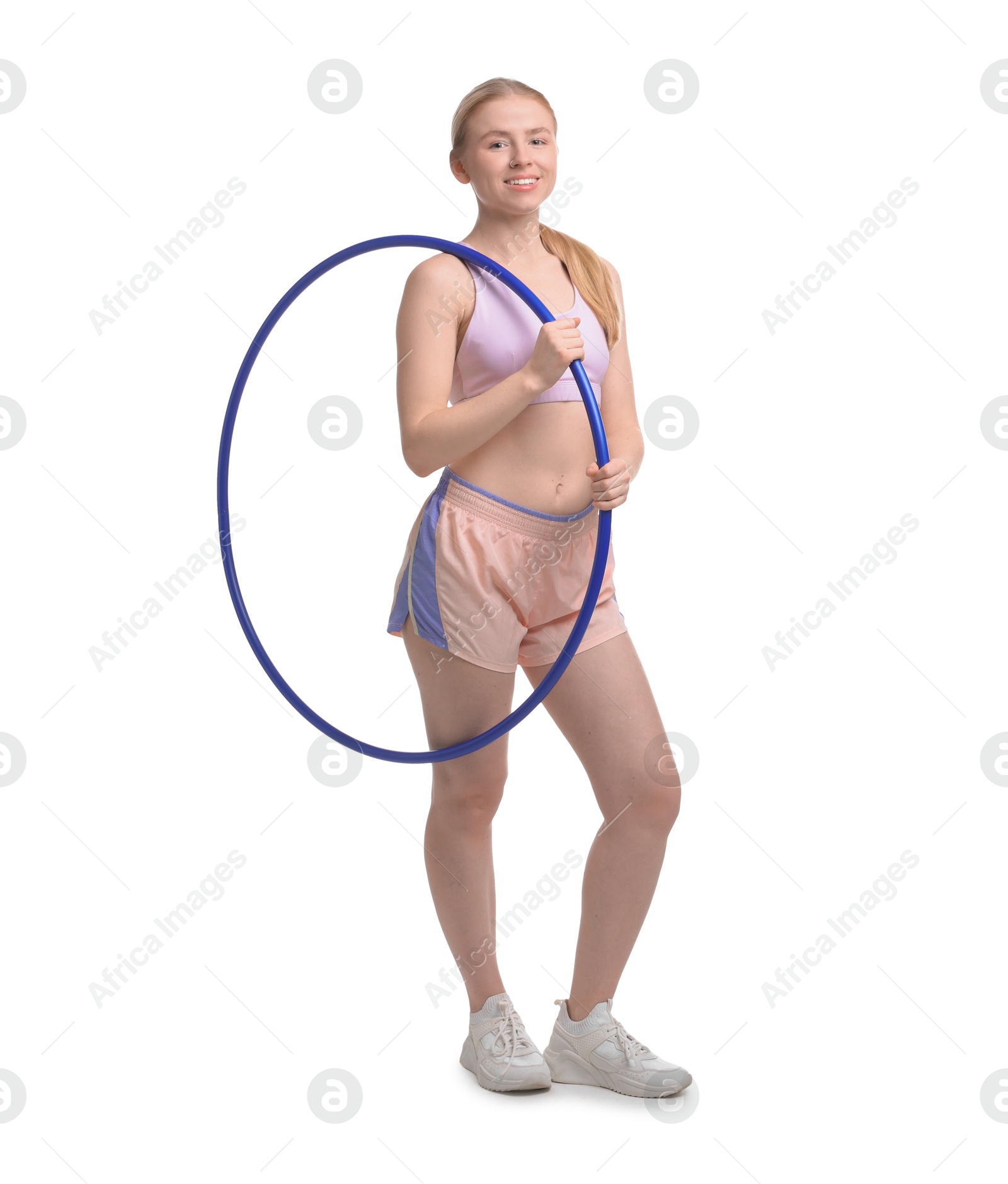 Photo of Beautiful young woman with hula hoop isolated on white