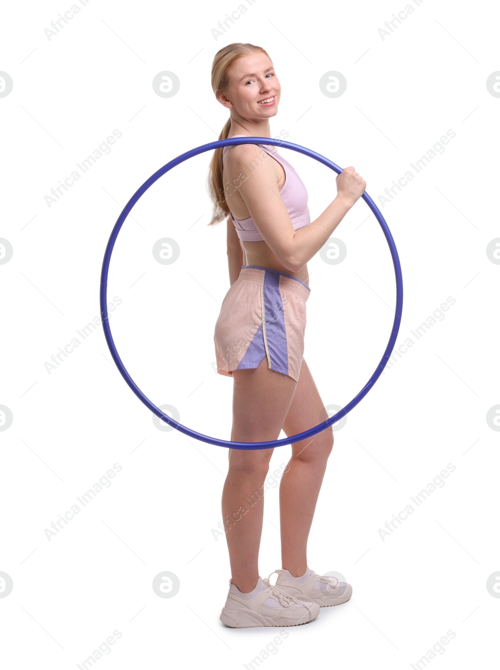 Photo of Beautiful young woman with hula hoop isolated on white