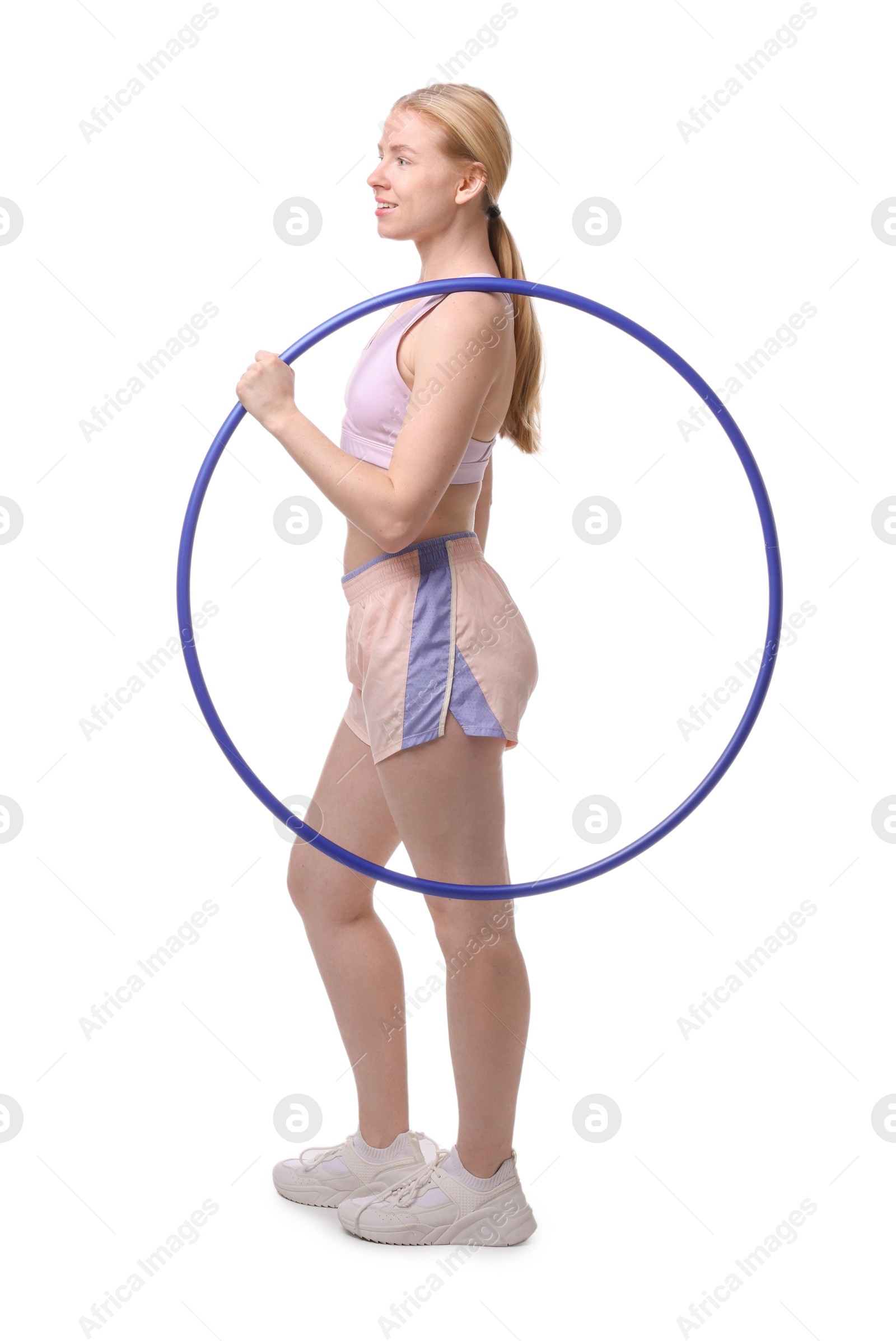 Photo of Beautiful young woman with hula hoop isolated on white