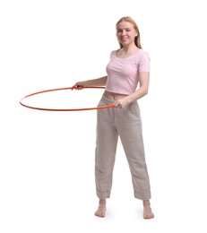 Photo of Beautiful young woman exercising with hula hoop on white background