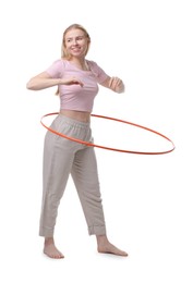 Photo of Beautiful young woman exercising with hula hoop on white background