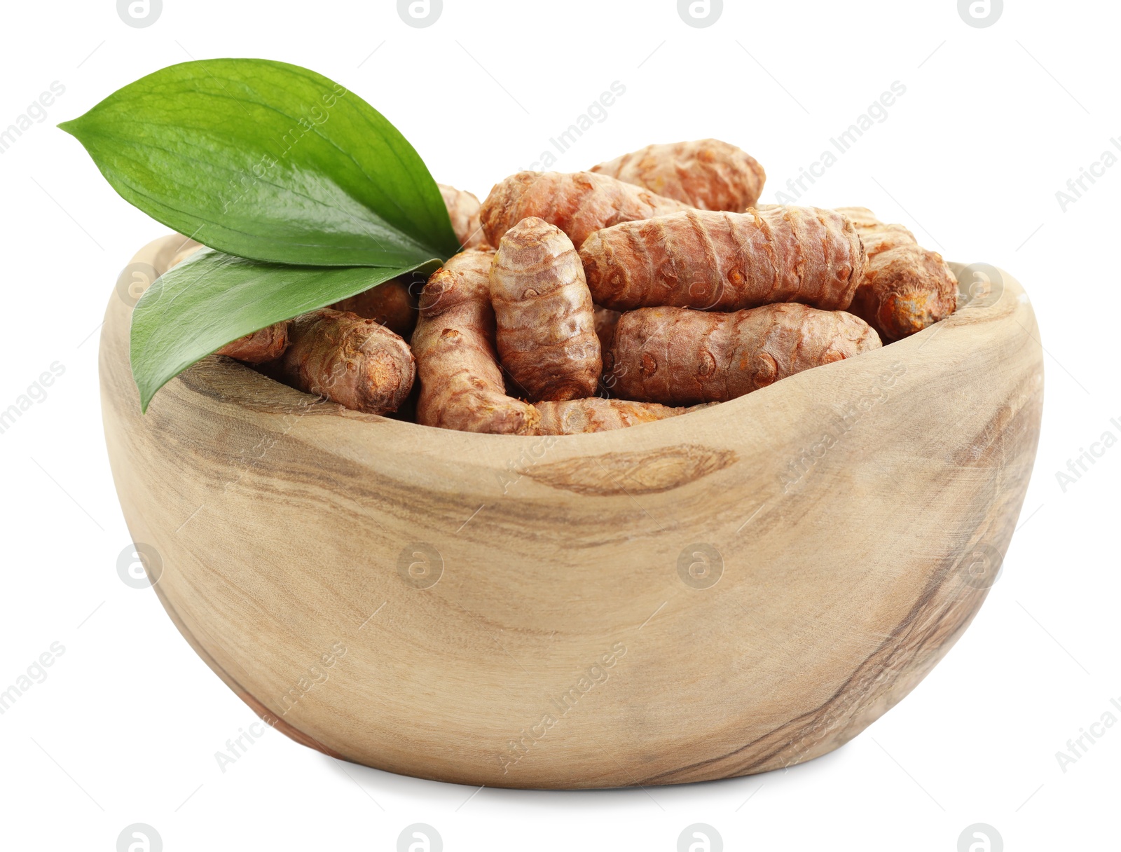 Photo of Raw turmeric roots and green leaves in bowl isolated on white