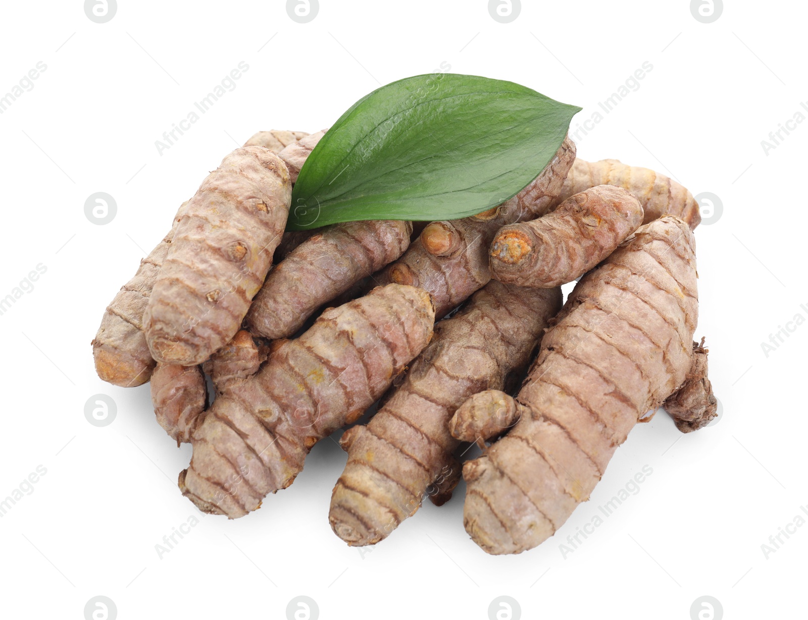 Photo of Raw turmeric roots and green leaf isolated on white