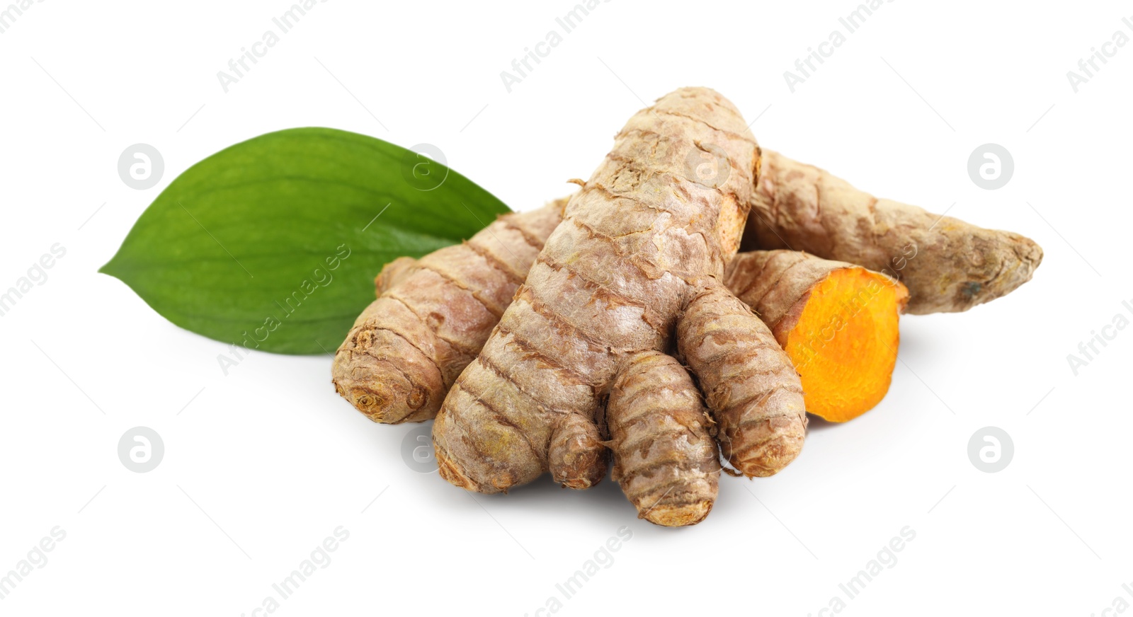 Photo of Tumeric rhizomes with leaf isolated on white