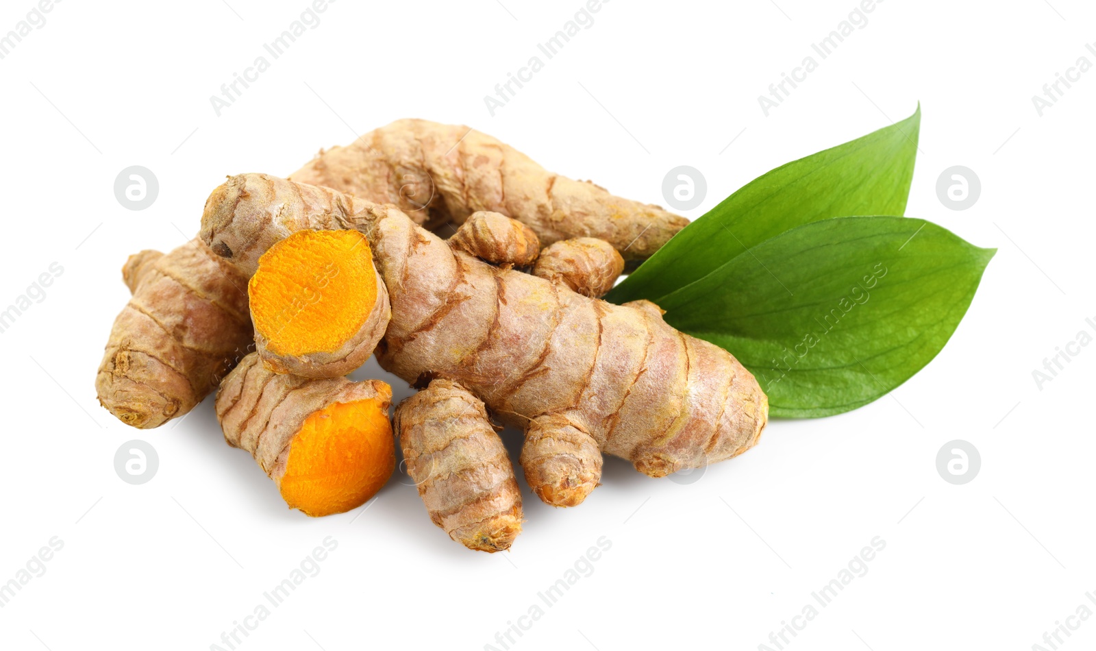 Photo of Tumeric rhizomes with leaves isolated on white