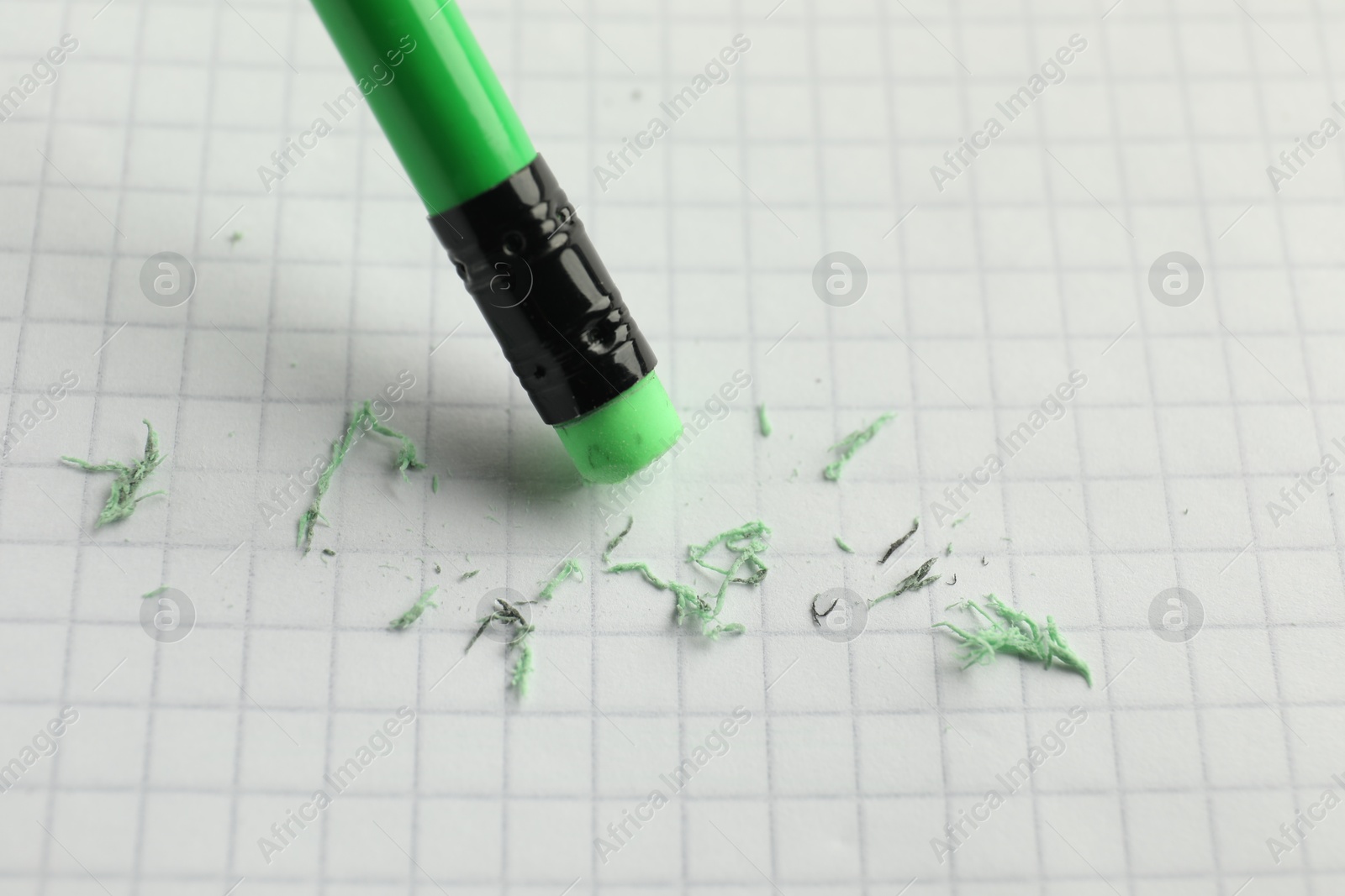 Using pencil with eraser on white sheet of paper, closeup Photo of Using pencil with eraser on white sheet of paper, closeup