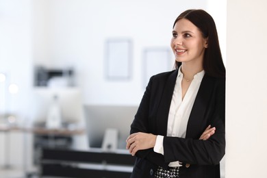 Photo of Portrait of banker with crossed arms in office, space for text