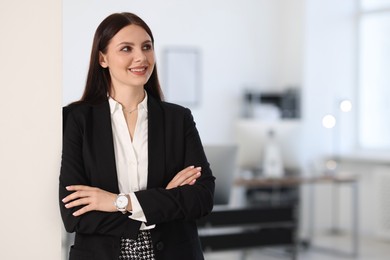 Photo of Portrait of banker with crossed arms in office, space for text