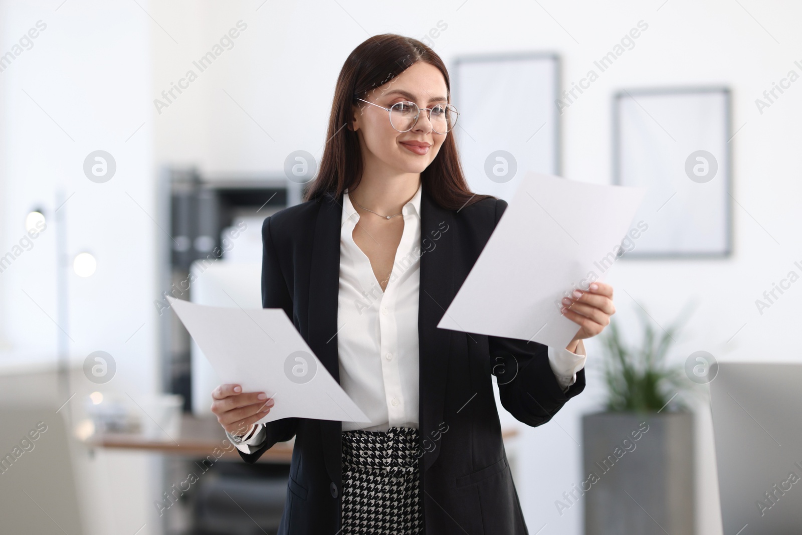 Photo of Portrait of banker with documents in office