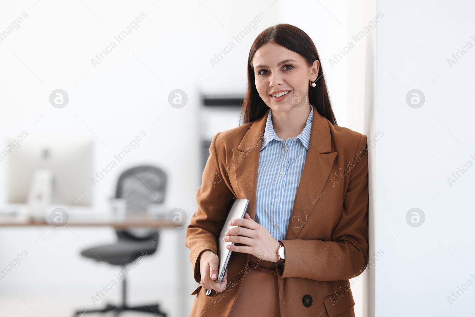 Photo of Banker with laptop in office, space for text