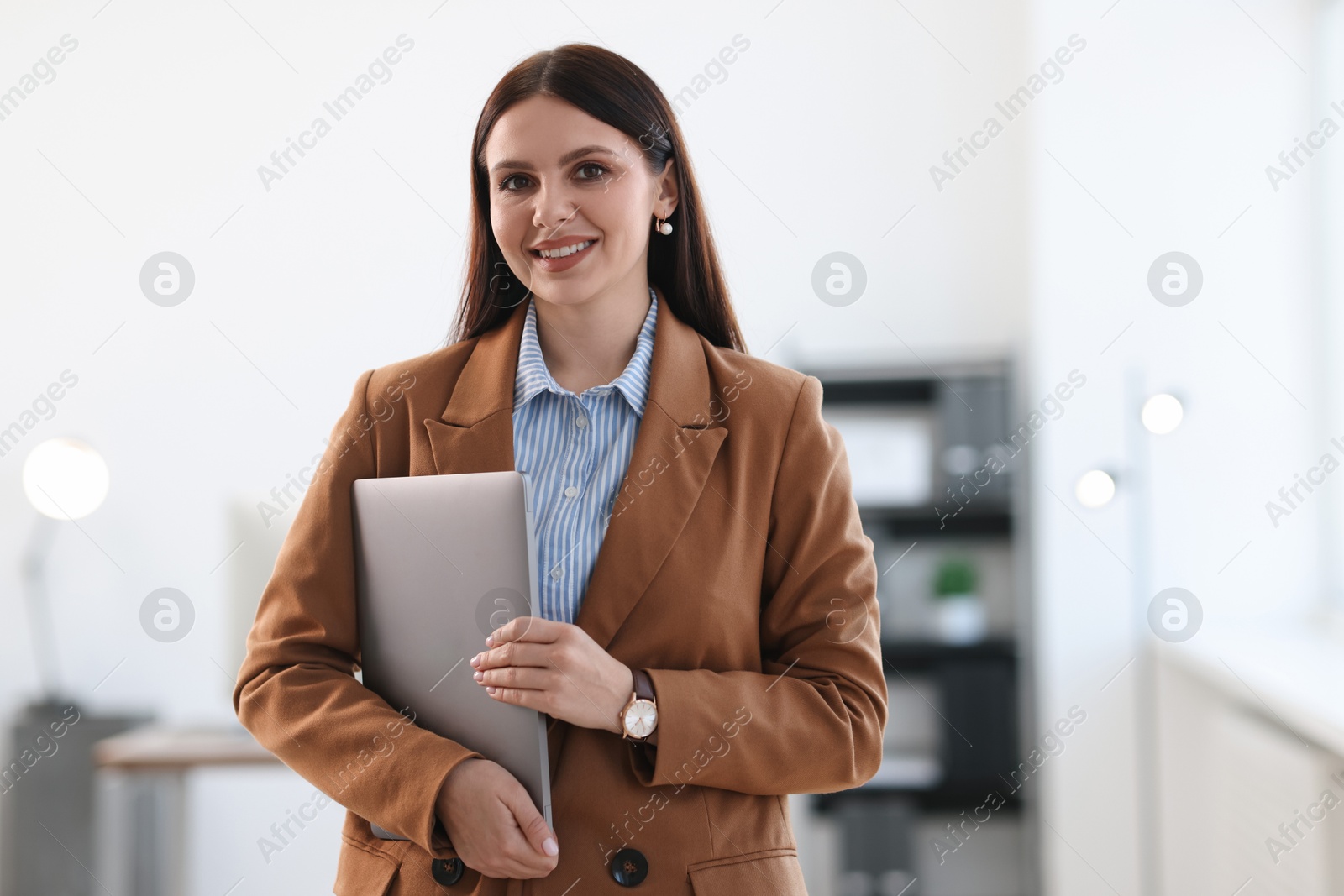 Photo of Banker with laptop in office, space for text