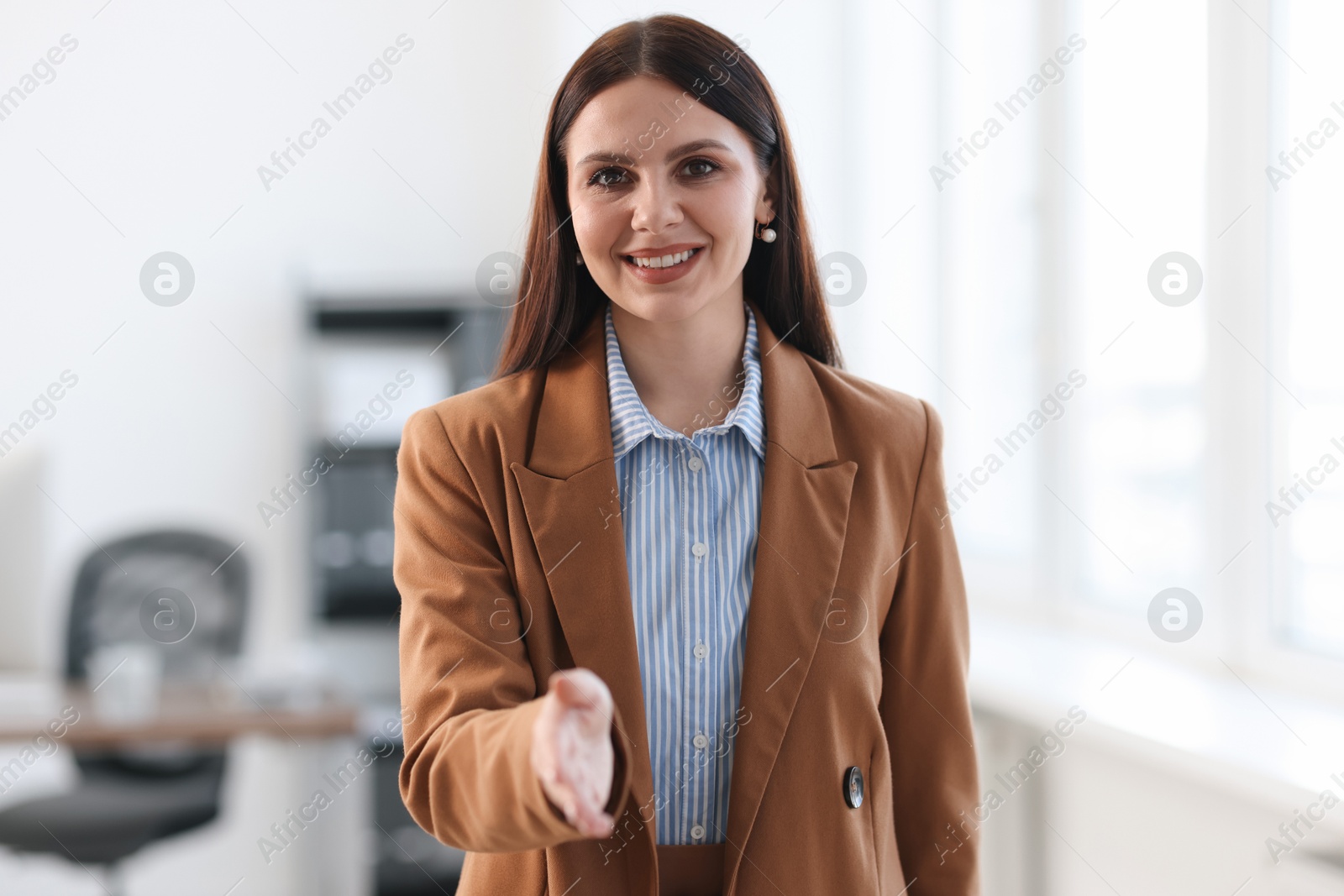 Photo of Portrait of happy banker in jacket indoors