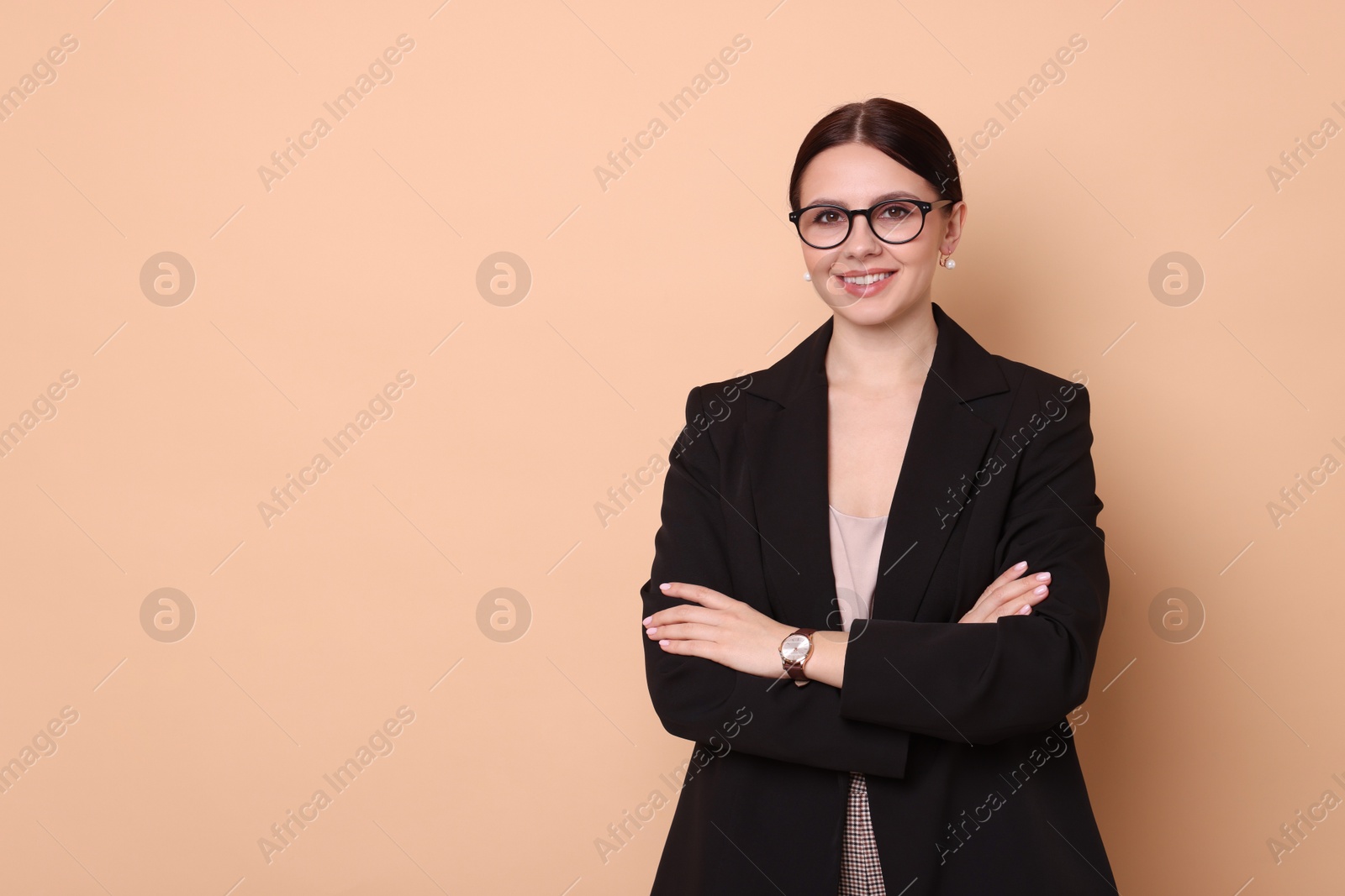 Photo of Portrait of banker with crossed arms on beige background, space for text