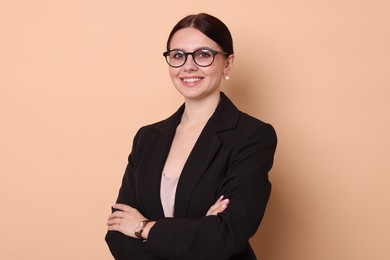 Photo of Portrait of banker with crossed arms on beige background