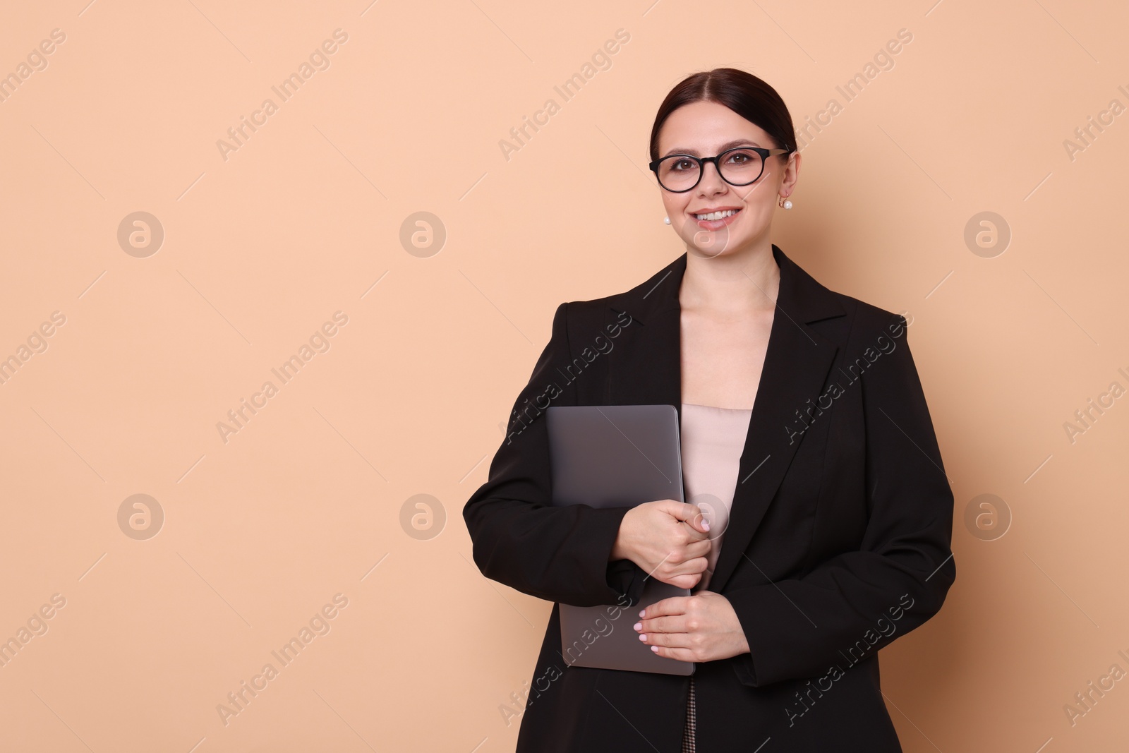 Photo of Portrait of banker with laptop on beige background, space for text