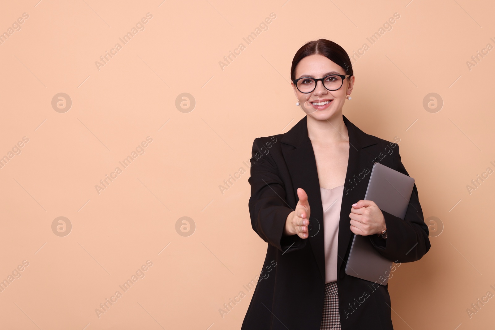 Photo of Portrait of banker with laptop on beige background, space for text