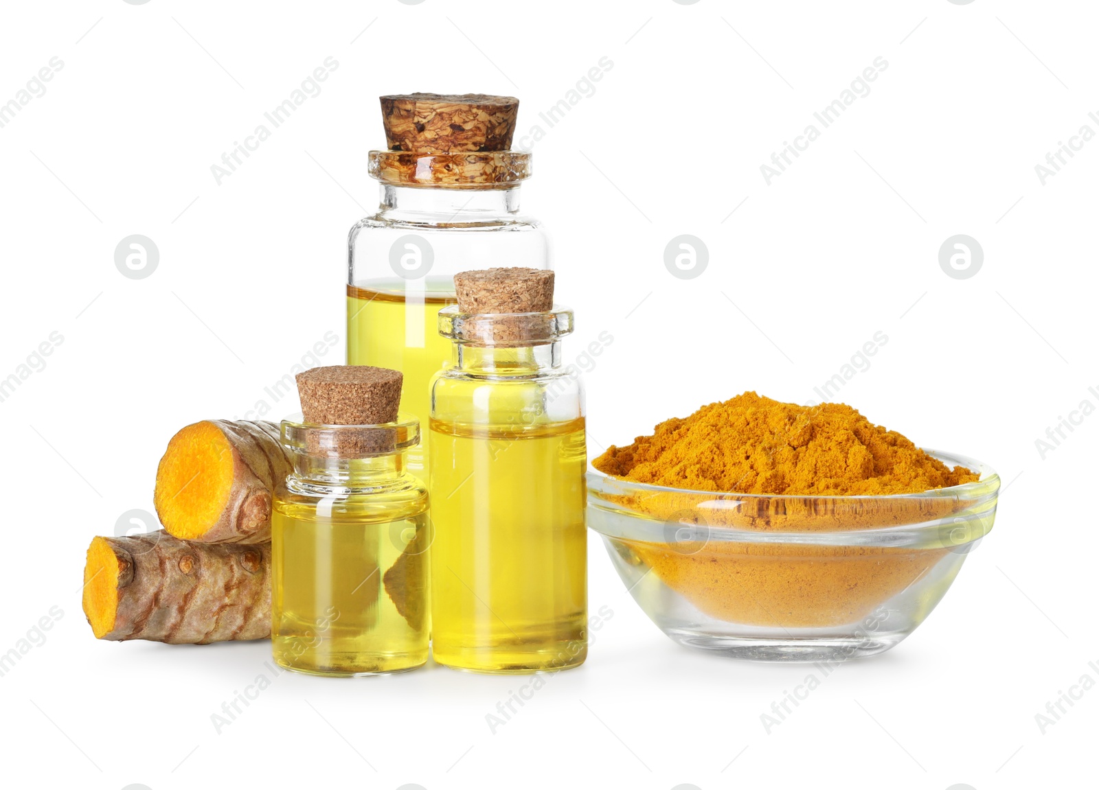 Photo of Bottles of turmeric essential oil, powder and raw roots isolated on white