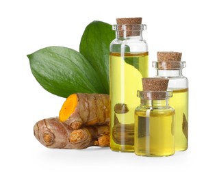 Photo of Bottles of turmeric essential oil, raw roots and leaves isolated on white