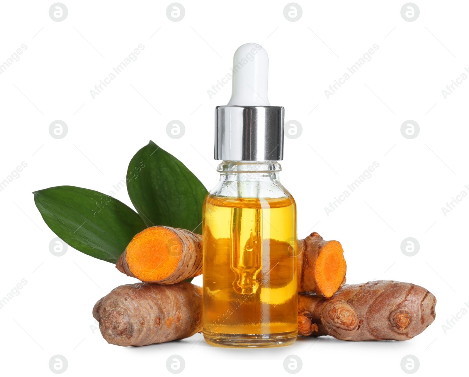 Photo of Bottle of turmeric essential oil, raw roots and leaves isolated on white