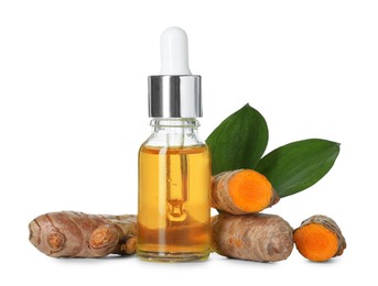 Photo of Bottle of turmeric essential oil, raw roots and leaves isolated on white