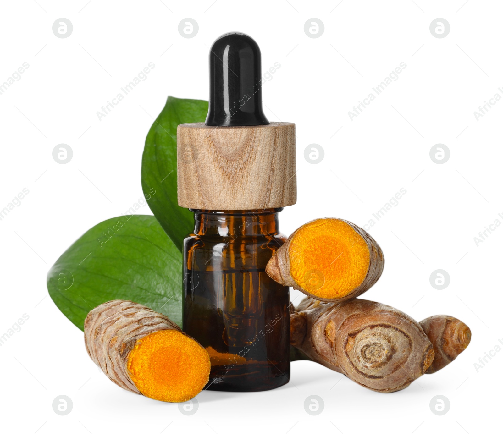 Photo of Bottle of turmeric essential oil, raw roots and leaves isolated on white