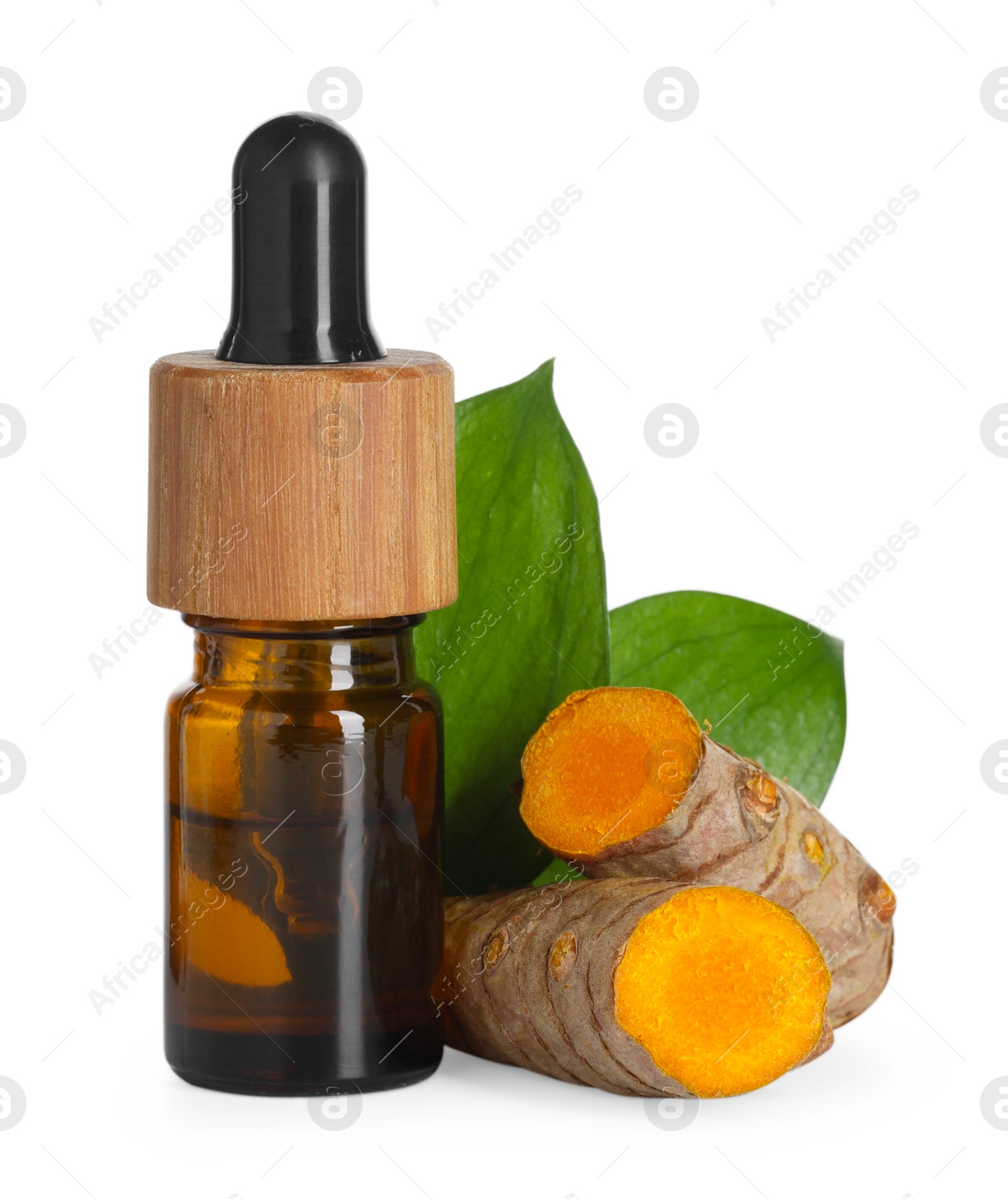 Photo of Bottle of turmeric essential oil, raw roots and leaves isolated on white