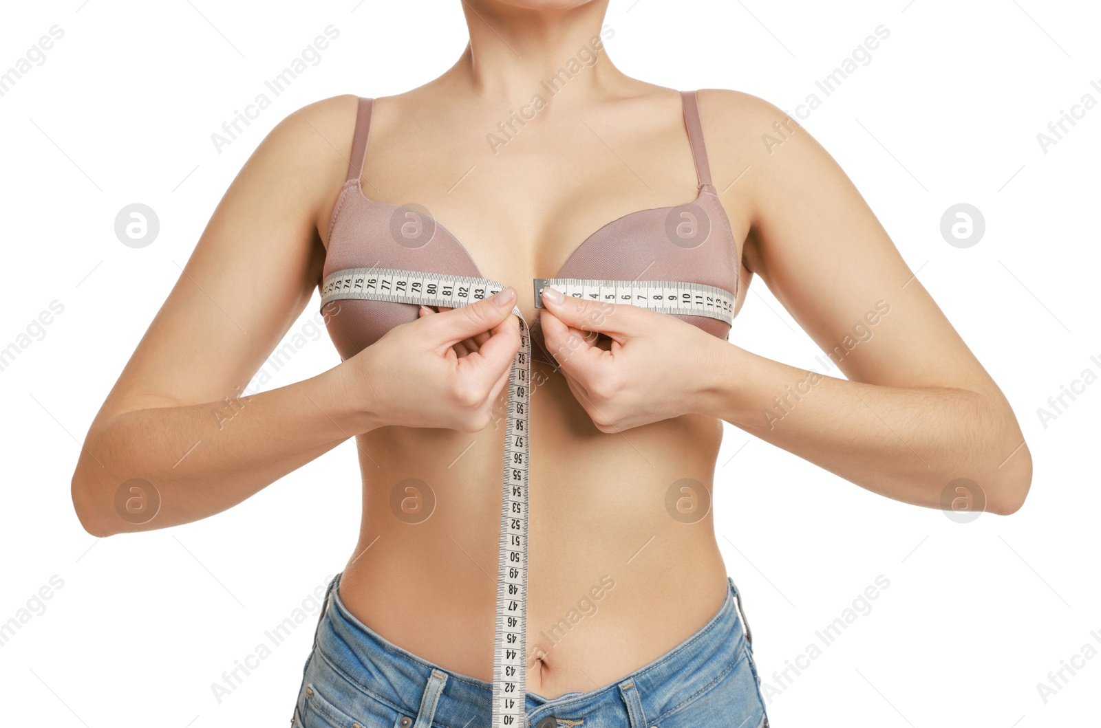 Photo of Woman in beautiful bra measuring breast circumference on white background, closeup