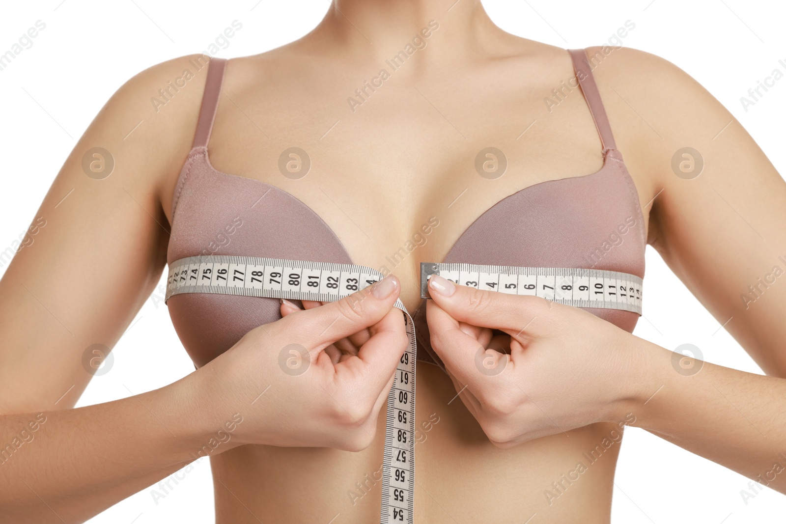 Photo of Woman in beautiful bra measuring breast circumference on white background, closeup