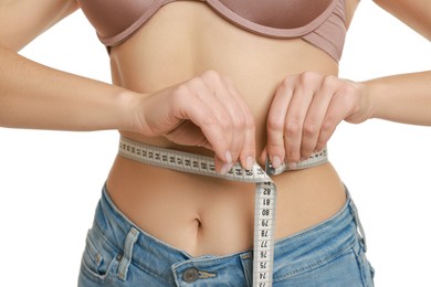 Photo of Woman measuring waist circumference on white background, closeup