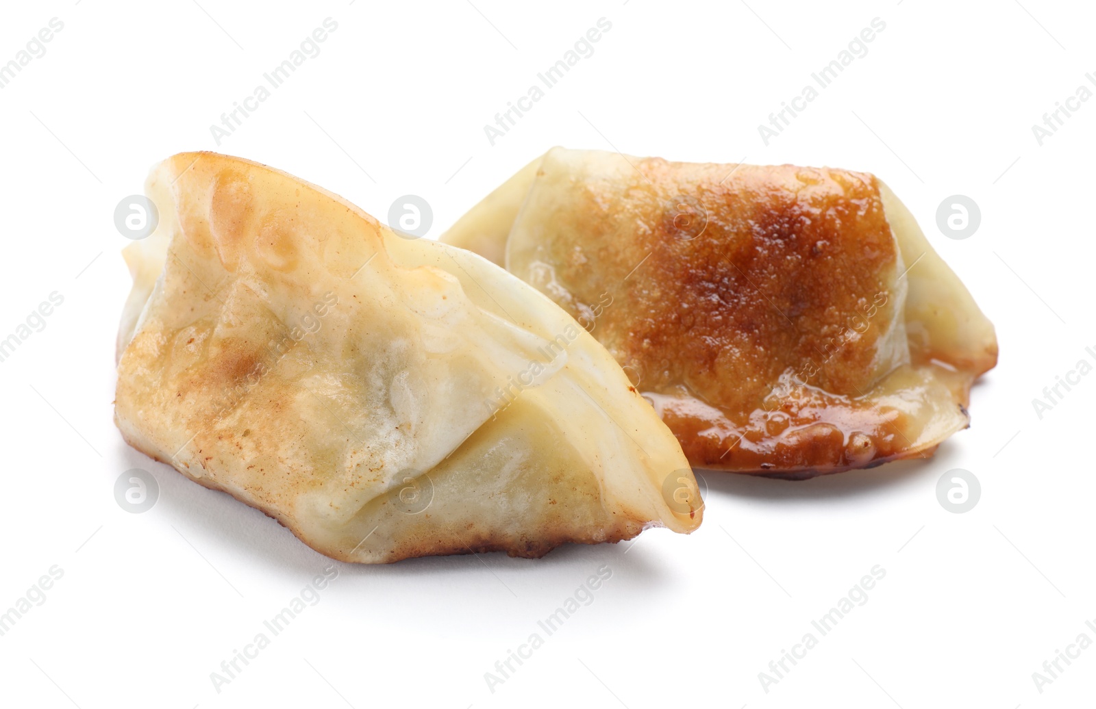 Photo of Delicious fried gyoza dumplings isolated on white