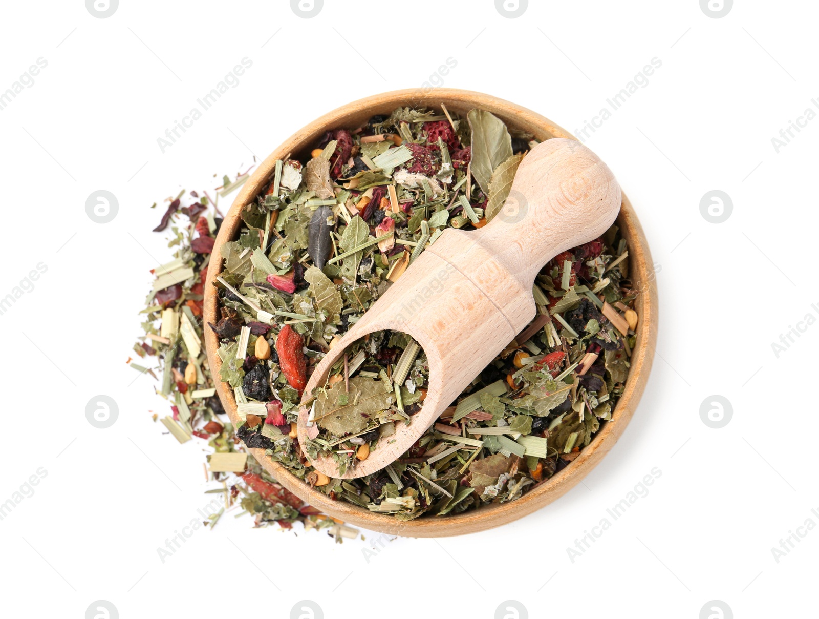 Photo of Dry herbal tea brew in bowl with scoop isolated on white, top view