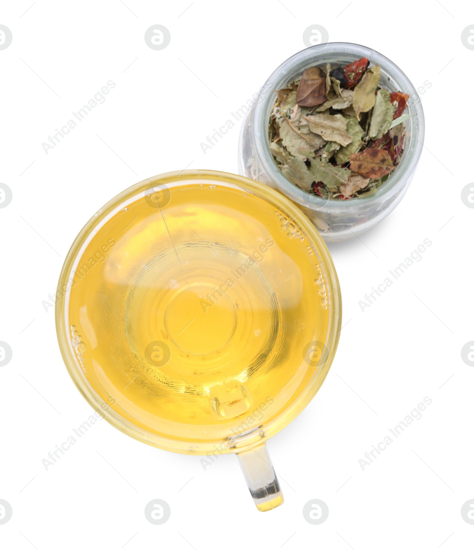 Photo of Delicious herbal tea and dry leaves isolated on white, top view