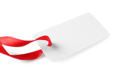 Photo of Blank tag with ribbon isolated on white