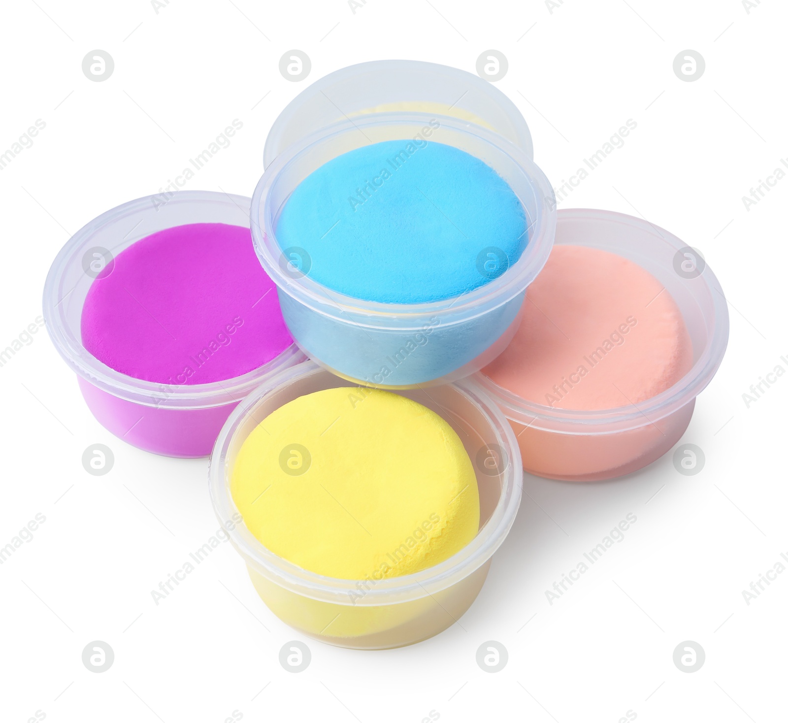 Photo of Different colorful modeling clay in plastic jars isolated on white