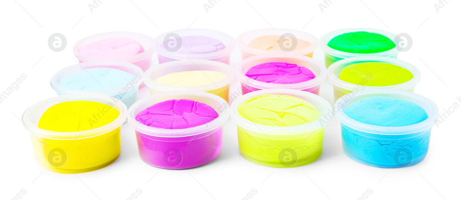 Photo of Different colorful modeling clay in plastic jars isolated on white