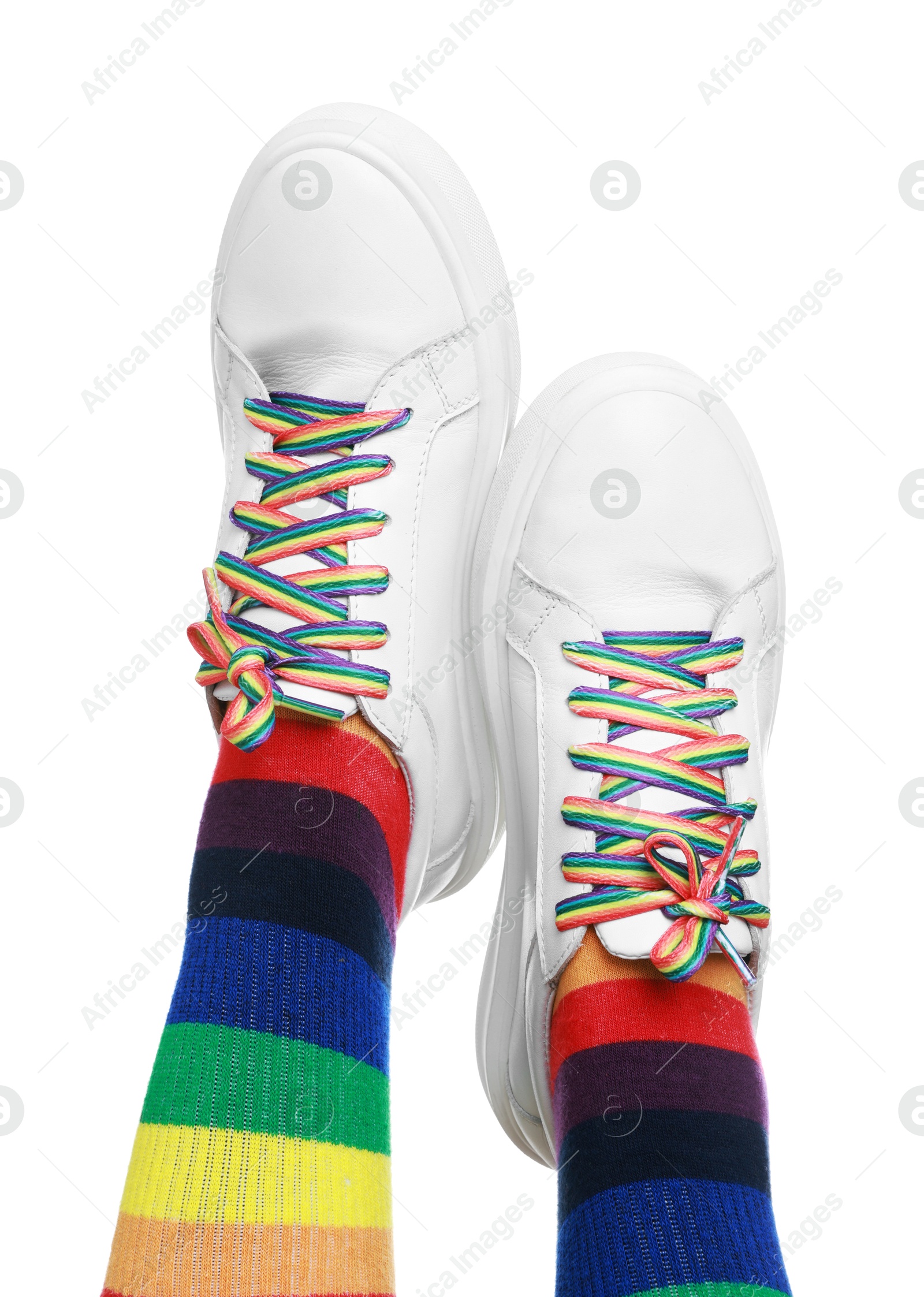 Photo of Woman wearing socks in LGBT colors on white background, closeup