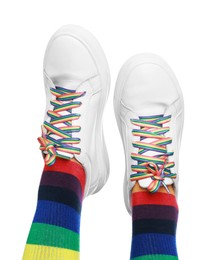 Photo of Woman wearing socks in LGBT colors on white background, closeup