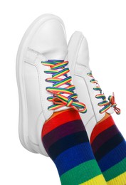 Photo of Woman wearing socks in LGBT colors on white background, closeup