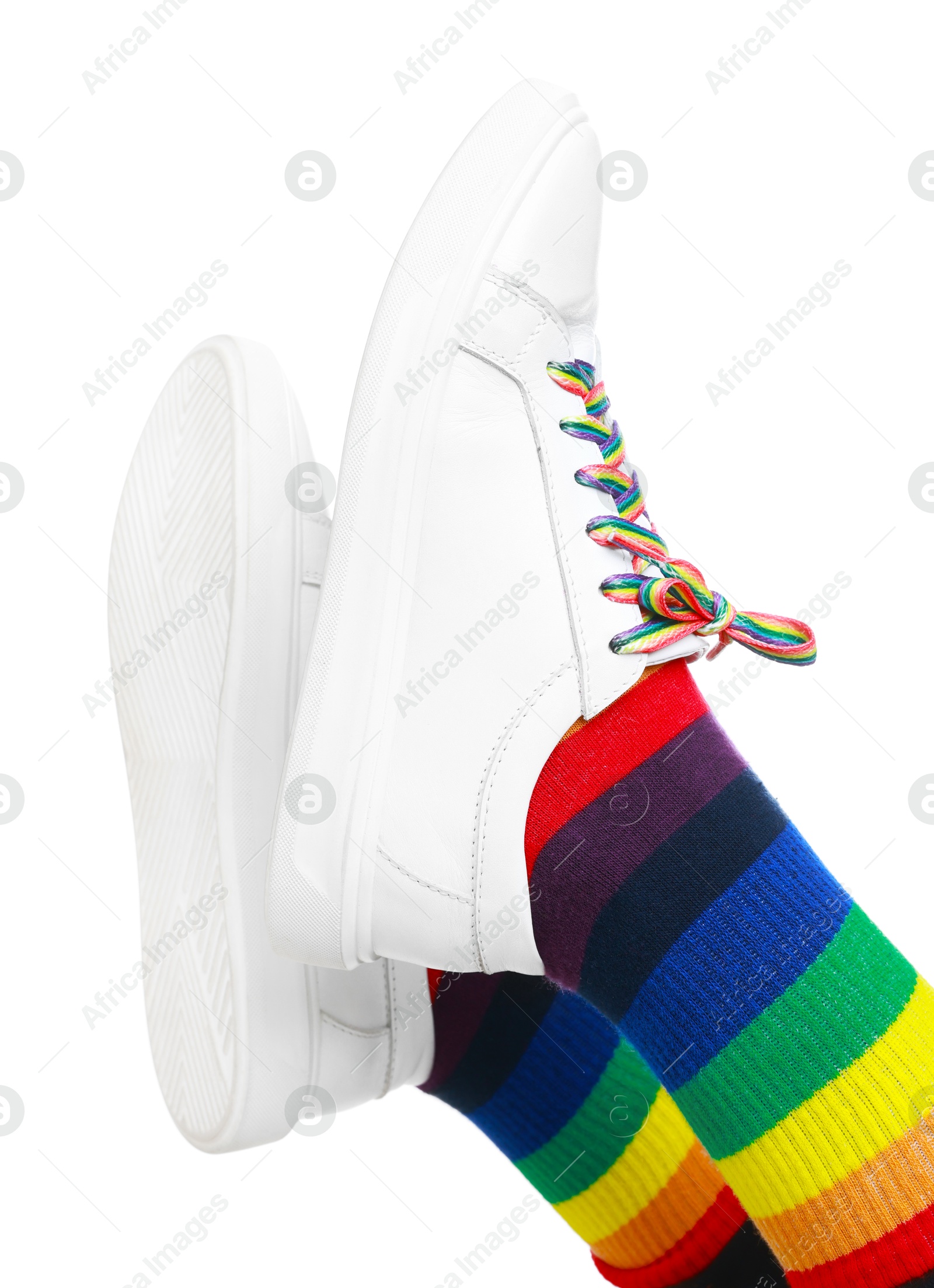 Photo of Woman wearing socks in LGBT colors on white background, closeup