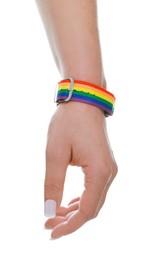 Photo of Woman wearing wristband in LGBT colors on white background, closeup