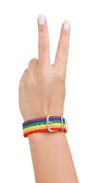 Photo of Woman wearing wristband in LGBT colors and showing peace sign on white background, closeup