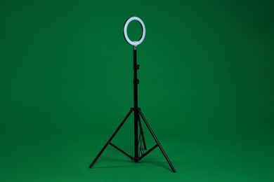 Photo of Ring lamp on stand against green background