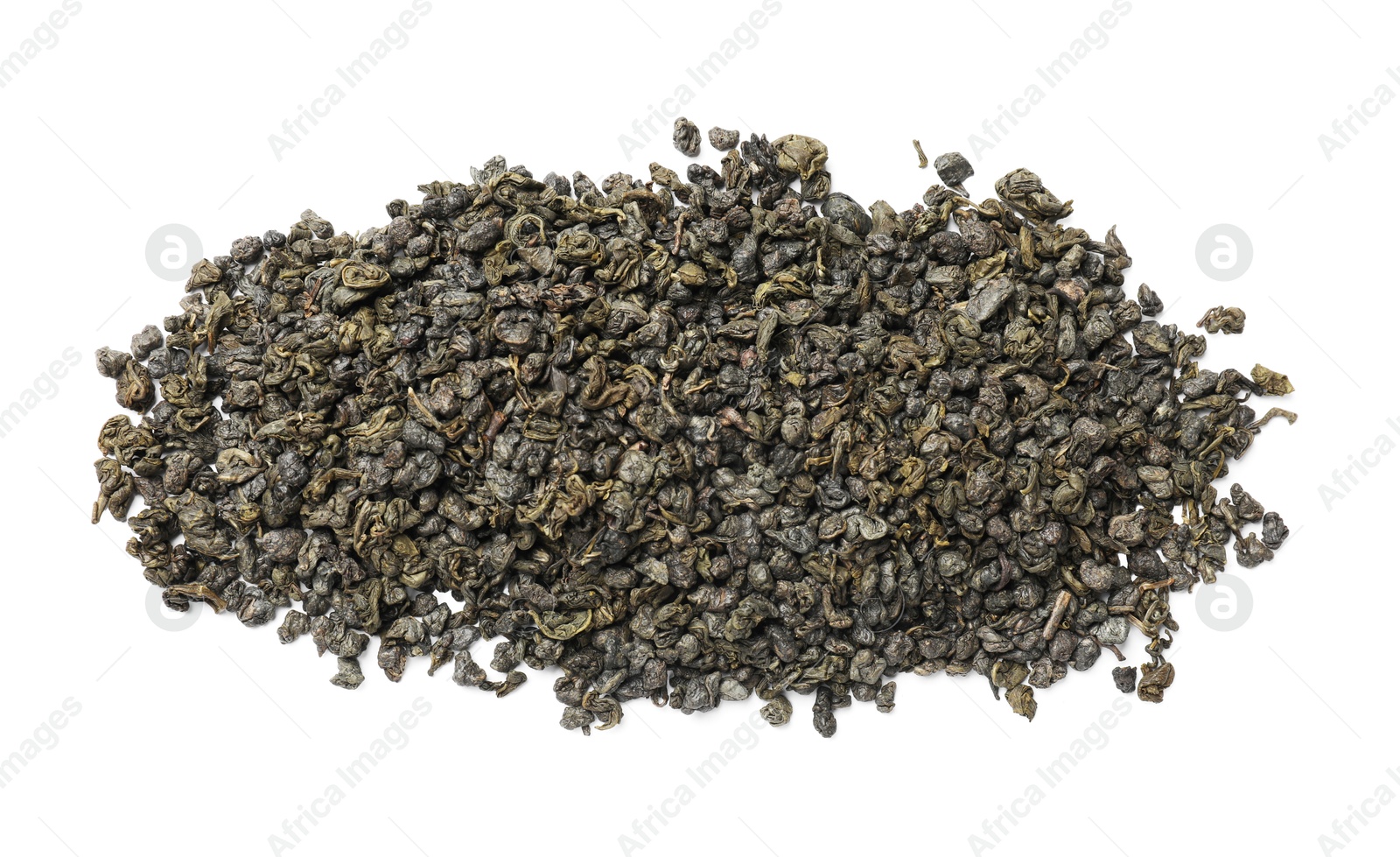 Photo of Pile of dry tea leaves isolated on white, top view