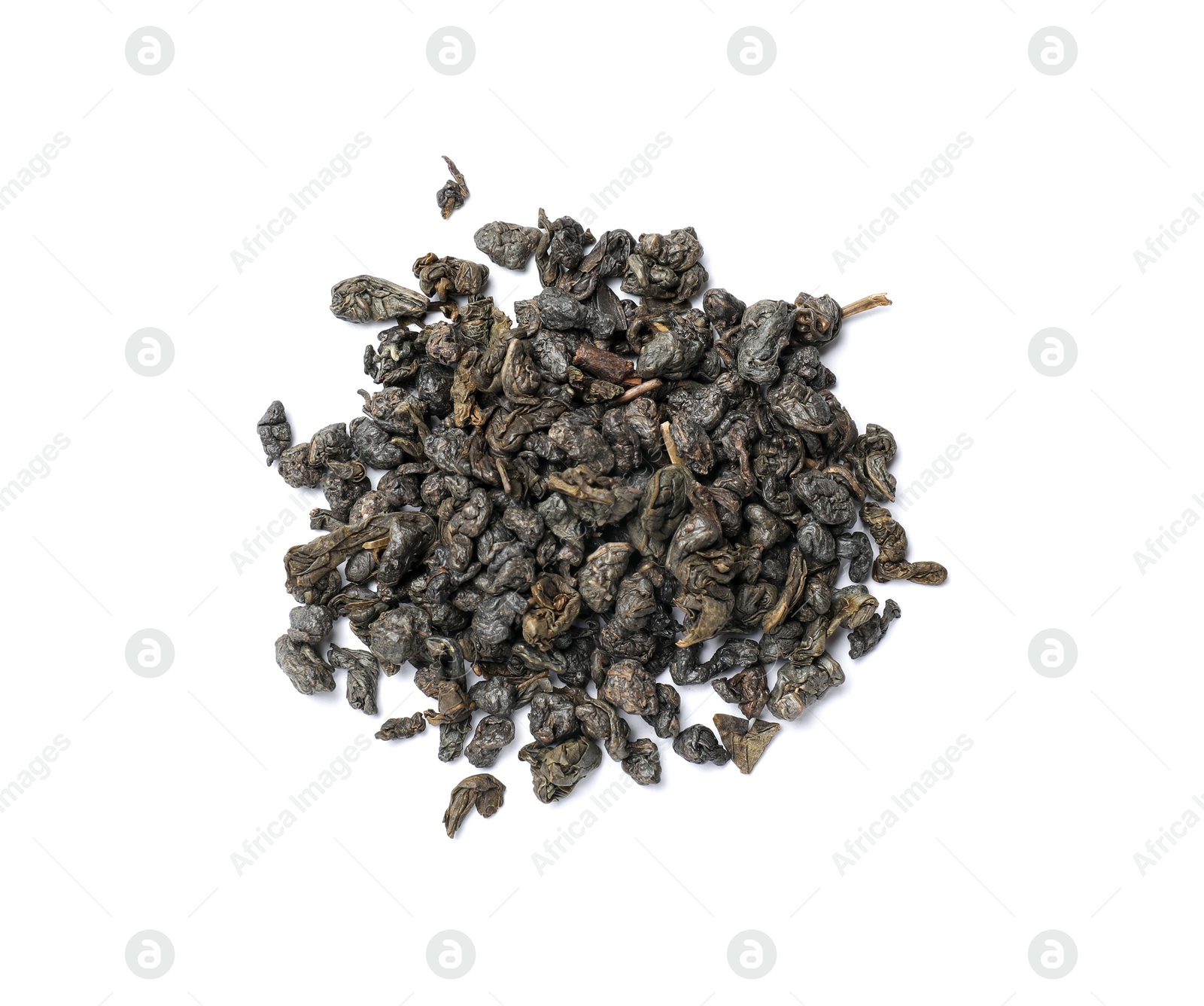 Photo of Pile of dry tea leaves isolated on white, top view