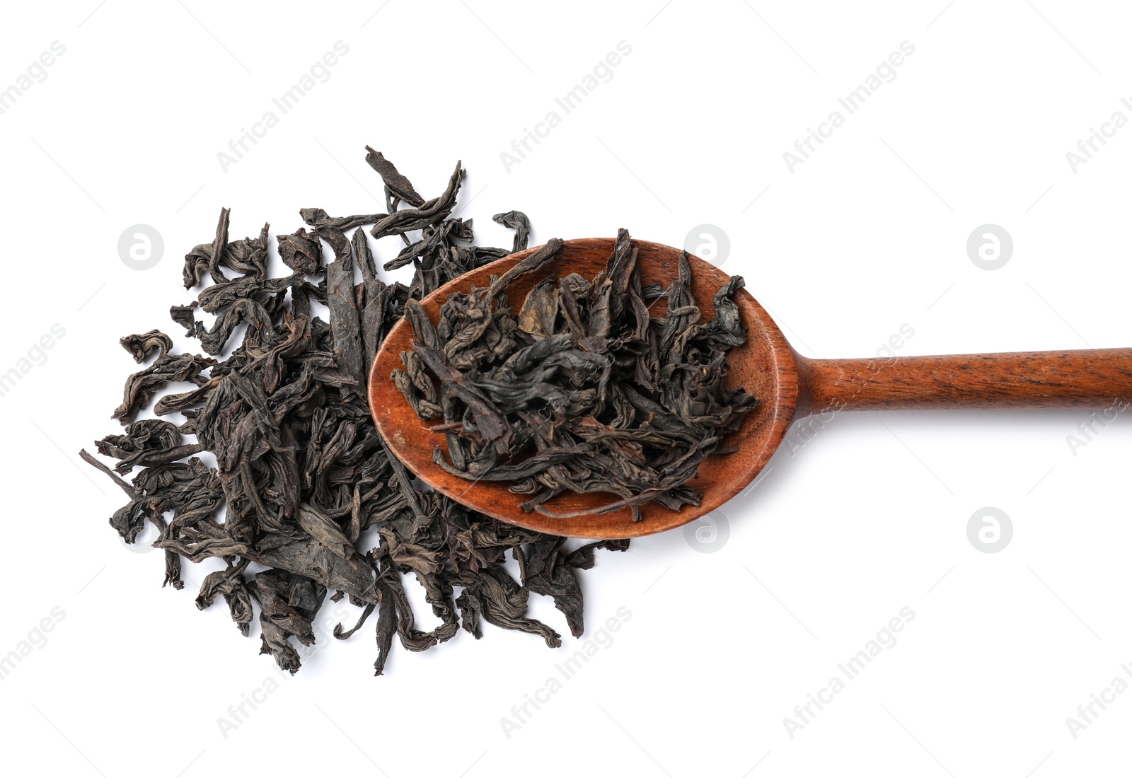 Photo of Dry tea leaves in wooden spoon isolated on white, top view