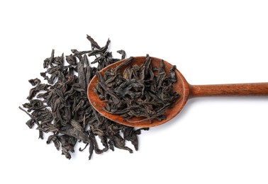 Photo of Dry tea leaves in wooden spoon isolated on white, top view